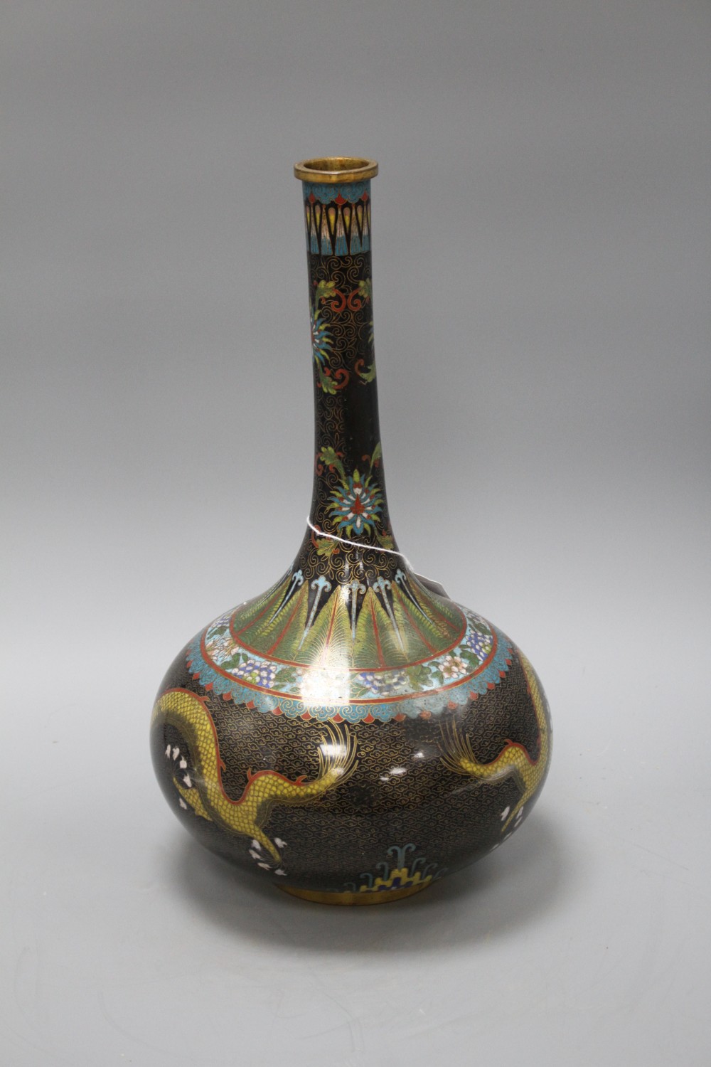 An early 20th century Chinese cloisonne vase, decorated with dragons on a black ground, height 38cm